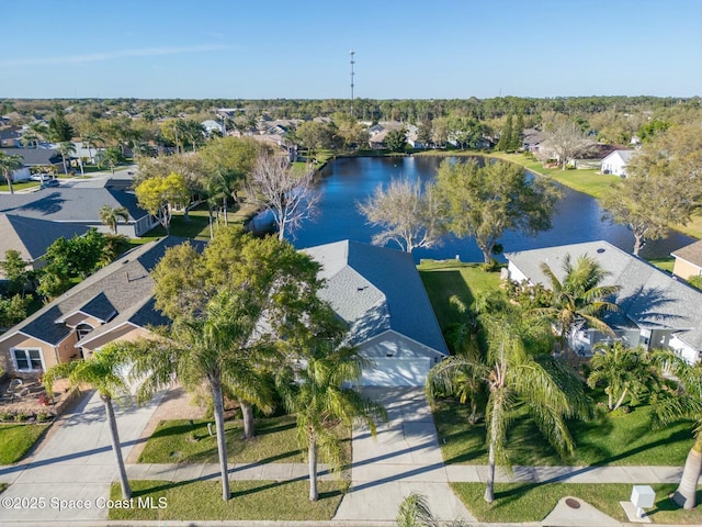 birds eye view of property with a water view and a residential view