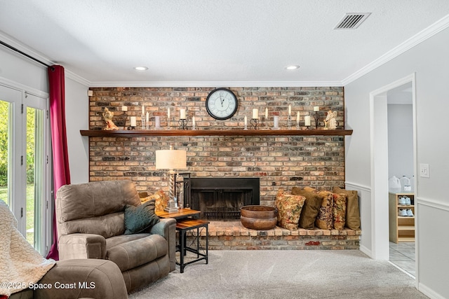 living room with carpet, a brick fireplace, visible vents, and crown molding