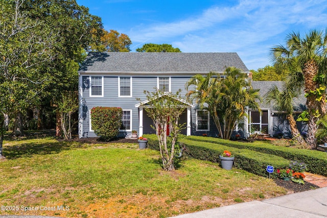 view of front of home featuring a front lawn