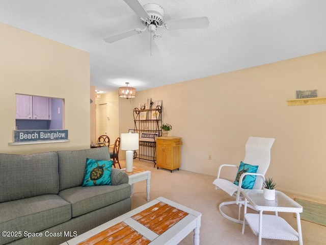 living room featuring light carpet and a ceiling fan