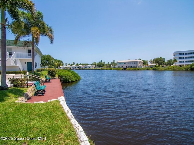 property view of water with a dock