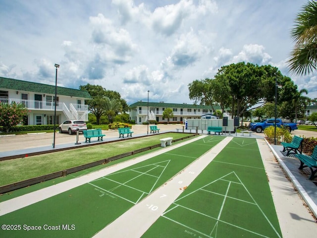 view of property's community featuring shuffleboard