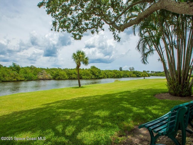 exterior space with a yard and a water view