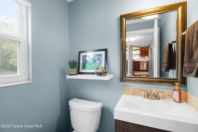 bathroom with vanity and toilet