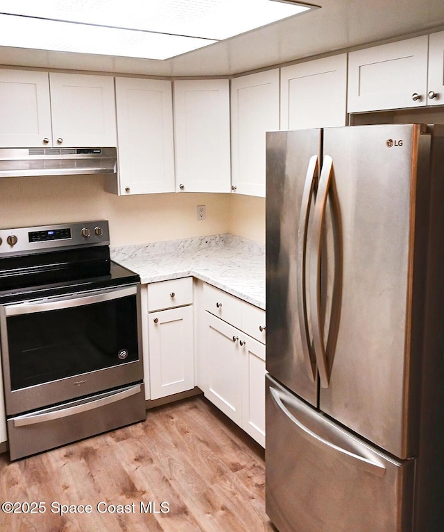 kitchen featuring appliances with stainless steel finishes, light wood-style flooring, white cabinetry, and under cabinet range hood