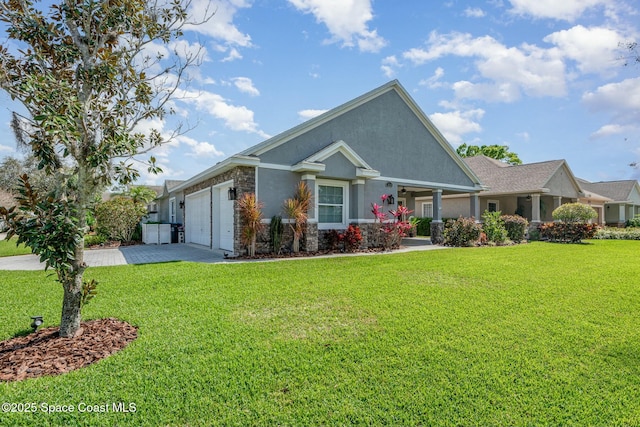 view of front of home featuring a front yard, driveway, an attached garage, and stucco siding