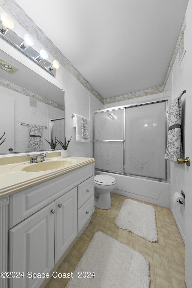 full bath with toilet, enclosed tub / shower combo, visible vents, and vanity