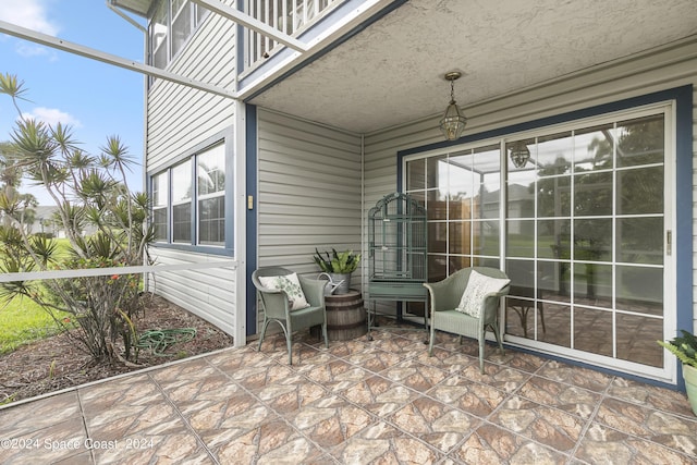 view of patio / terrace with glass enclosure