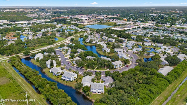 aerial view featuring a water view and a residential view