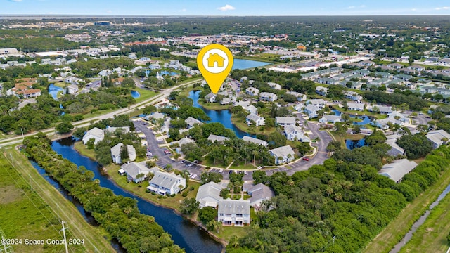 birds eye view of property featuring a water view and a residential view