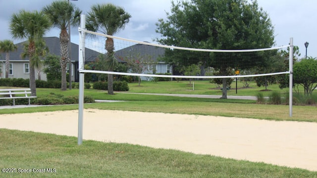 view of community with a yard and volleyball court