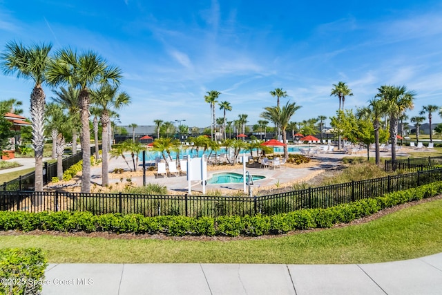 view of pool with fence