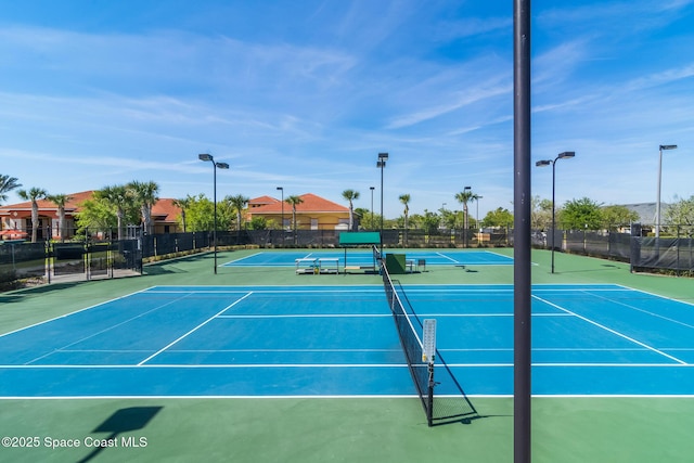 view of sport court with fence