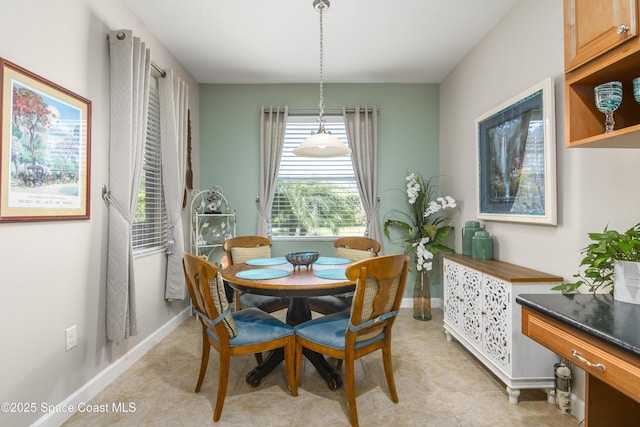 dining room featuring baseboards