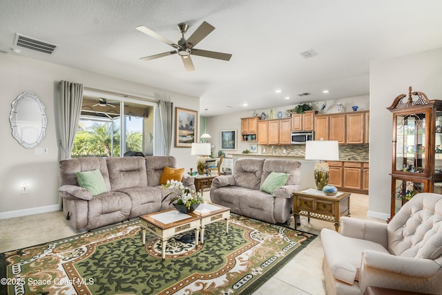 living room featuring light tile patterned floors, baseboards, visible vents, ceiling fan, and recessed lighting