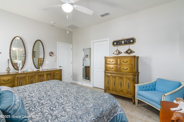 bedroom with light tile patterned floors, visible vents, and a ceiling fan