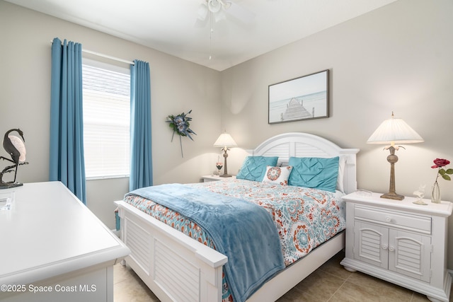 bedroom featuring light tile patterned floors and ceiling fan