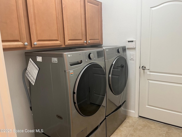 3485 Sansome Cir, Melbourne, FL 32940 - washroom with cabinet space, washing machine and dryer, and light tile patterned floors