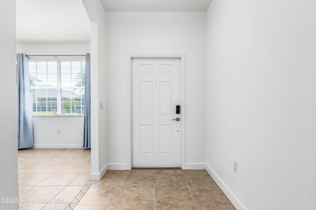 3485 Sansome Cir, Melbourne, FL 32940 - entrance foyer featuring baseboards and light tile patterned floors