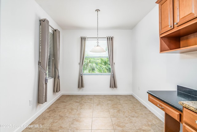 3485 Sansome Cir, Melbourne, FL 32940 - unfurnished dining area with baseboards and light tile patterned floors