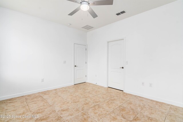 3485 Sansome Cir, Melbourne, FL 32940 - unfurnished room featuring a ceiling fan, tile patterned floors, and baseboards