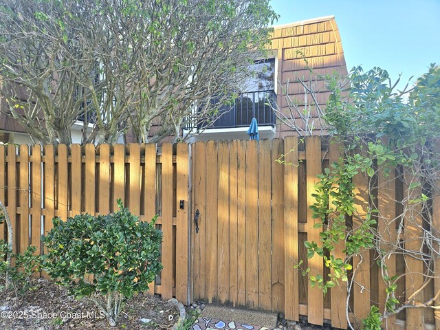 view of gate featuring fence