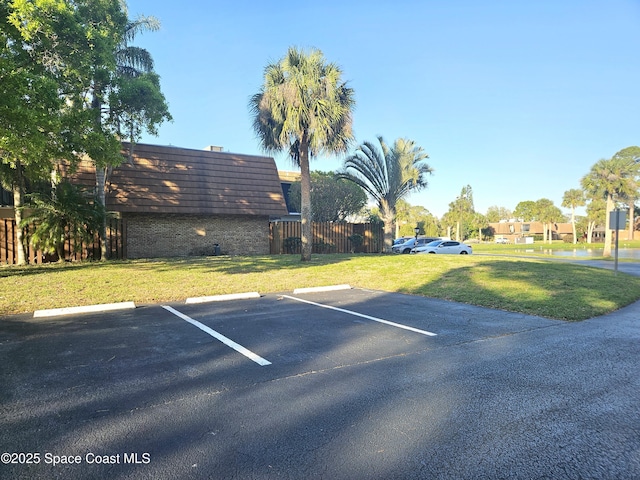 uncovered parking lot with fence