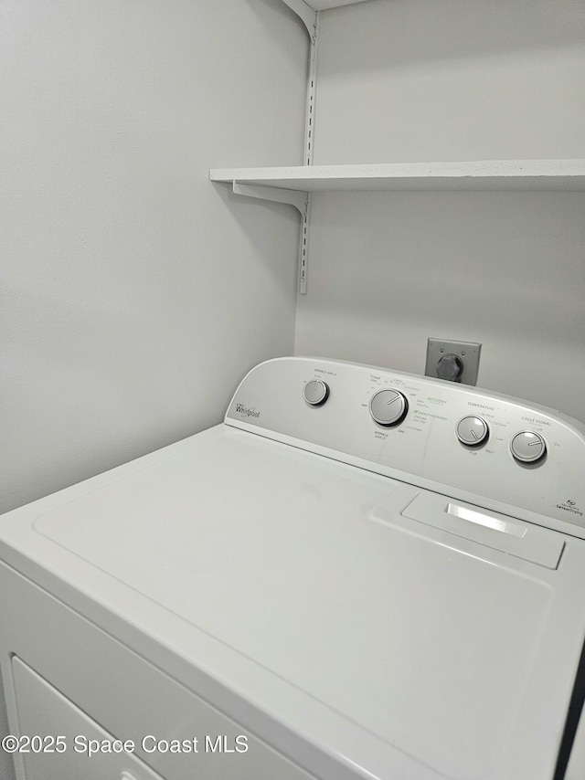 clothes washing area with laundry area and washer / clothes dryer