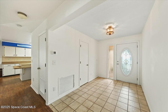 tiled foyer with visible vents