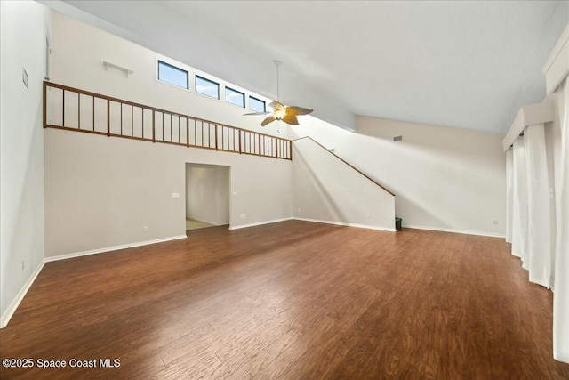 unfurnished living room featuring high vaulted ceiling, wood finished floors, a ceiling fan, and baseboards