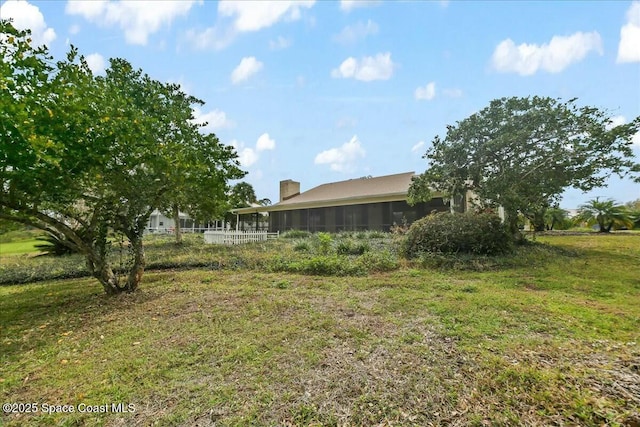 view of yard with a sunroom