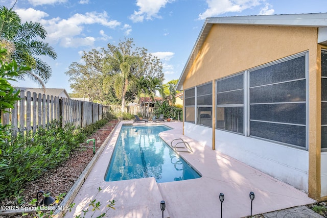 view of pool featuring a fenced in pool, a patio area, and a fenced backyard