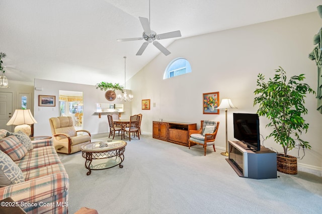 living room with baseboards, high vaulted ceiling, carpet, and a healthy amount of sunlight