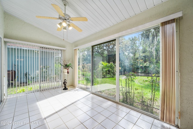 unfurnished sunroom with vaulted ceiling and ceiling fan