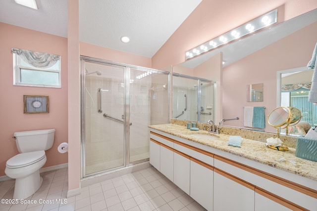 full bathroom featuring toilet, tile patterned floors, vaulted ceiling, vanity, and a shower stall