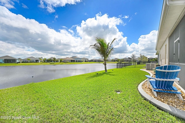 property view of water with a residential view and fence