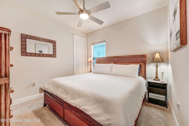 bedroom featuring light colored carpet, ceiling fan, and baseboards