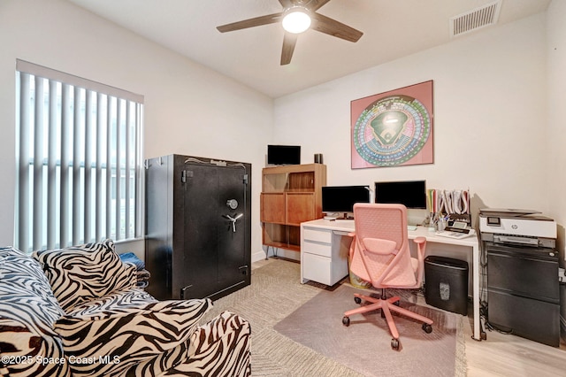 office area with visible vents and ceiling fan