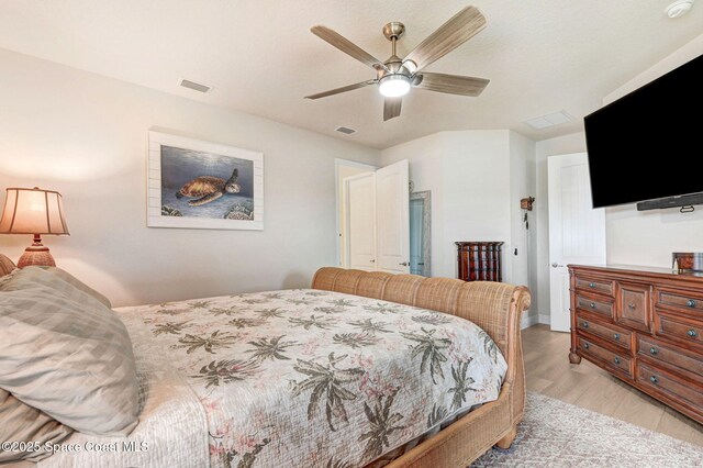 bedroom with visible vents, ceiling fan, and light wood finished floors