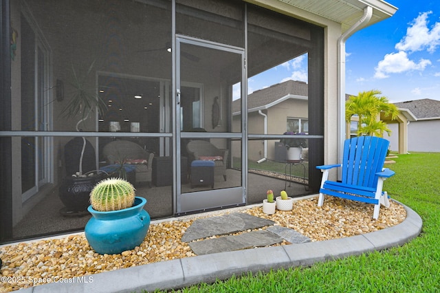 doorway to property with a yard