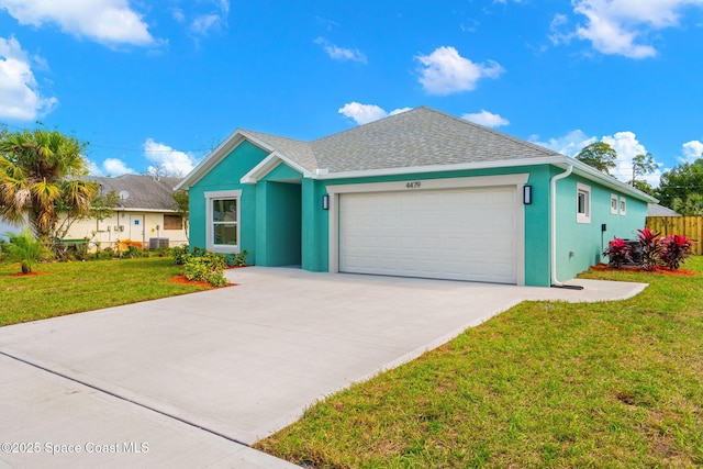 single story home with driveway, stucco siding, an attached garage, fence, and a front yard