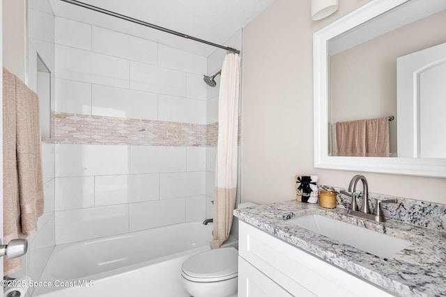 bathroom with shower / bath combination with curtain, vanity, and toilet