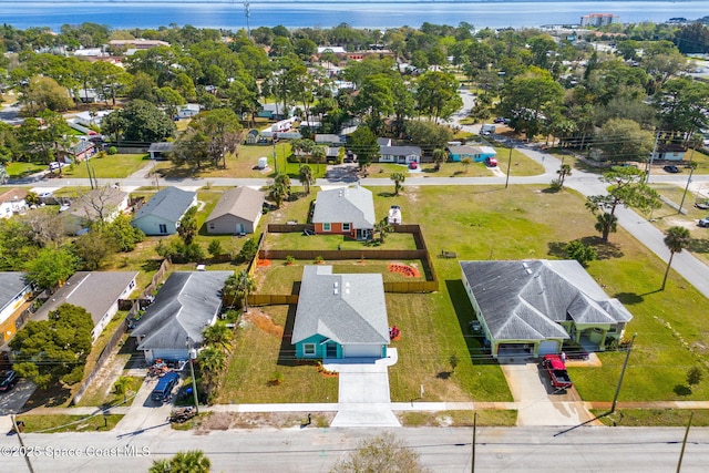 bird's eye view featuring a water view and a residential view