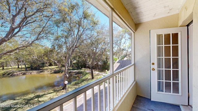 balcony featuring a water view