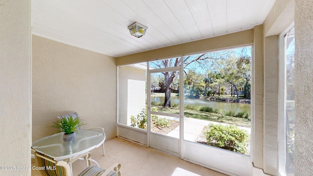 sunroom with a water view