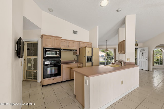 kitchen with a healthy amount of sunlight, black appliances, light tile patterned floors, and visible vents