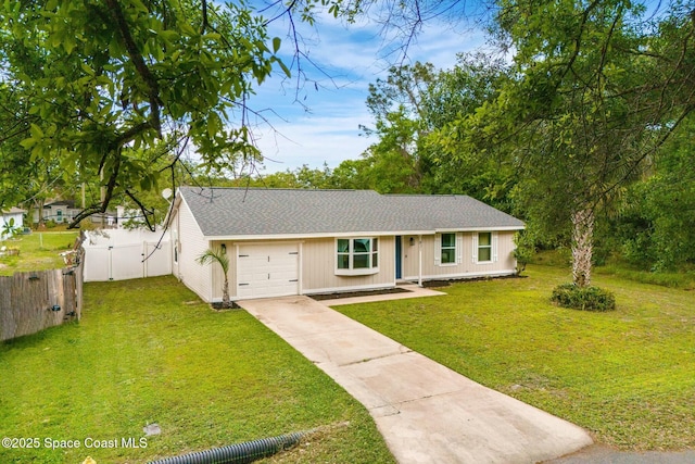 ranch-style house with a garage, driveway, a front lawn, and fence