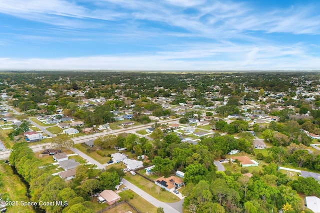 birds eye view of property with a residential view