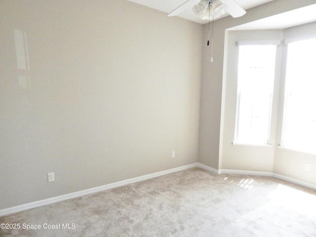 4590 Brantford Ct, Rockledge, FL 32955 - spare room featuring ceiling fan, light carpet, and baseboards