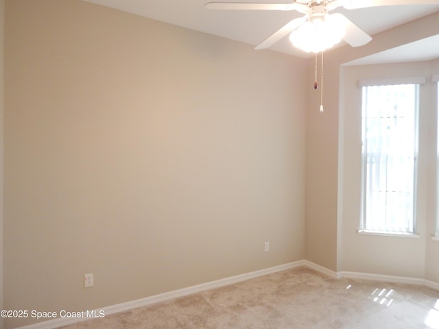 4590 Brantford Ct, Rockledge, FL 32955 - empty room with light carpet, baseboards, and a ceiling fan